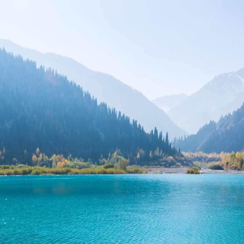 a body of water with a mountain in the background