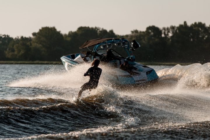 a man flying through the air while riding a wave